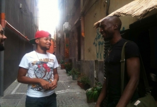 Judicael speaking outside the cafÃ© with a Capo Verde young friend, courtesy photo pr/undercover