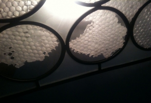 Daniela Manzolli's studio on handmade polished and carved glass applied to Venetian window style