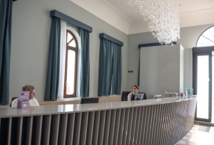VID - the reception (desk signed by Cosentino, Spain; cascade ceiling chandelier signed by Vistosi, Murano - Venice)